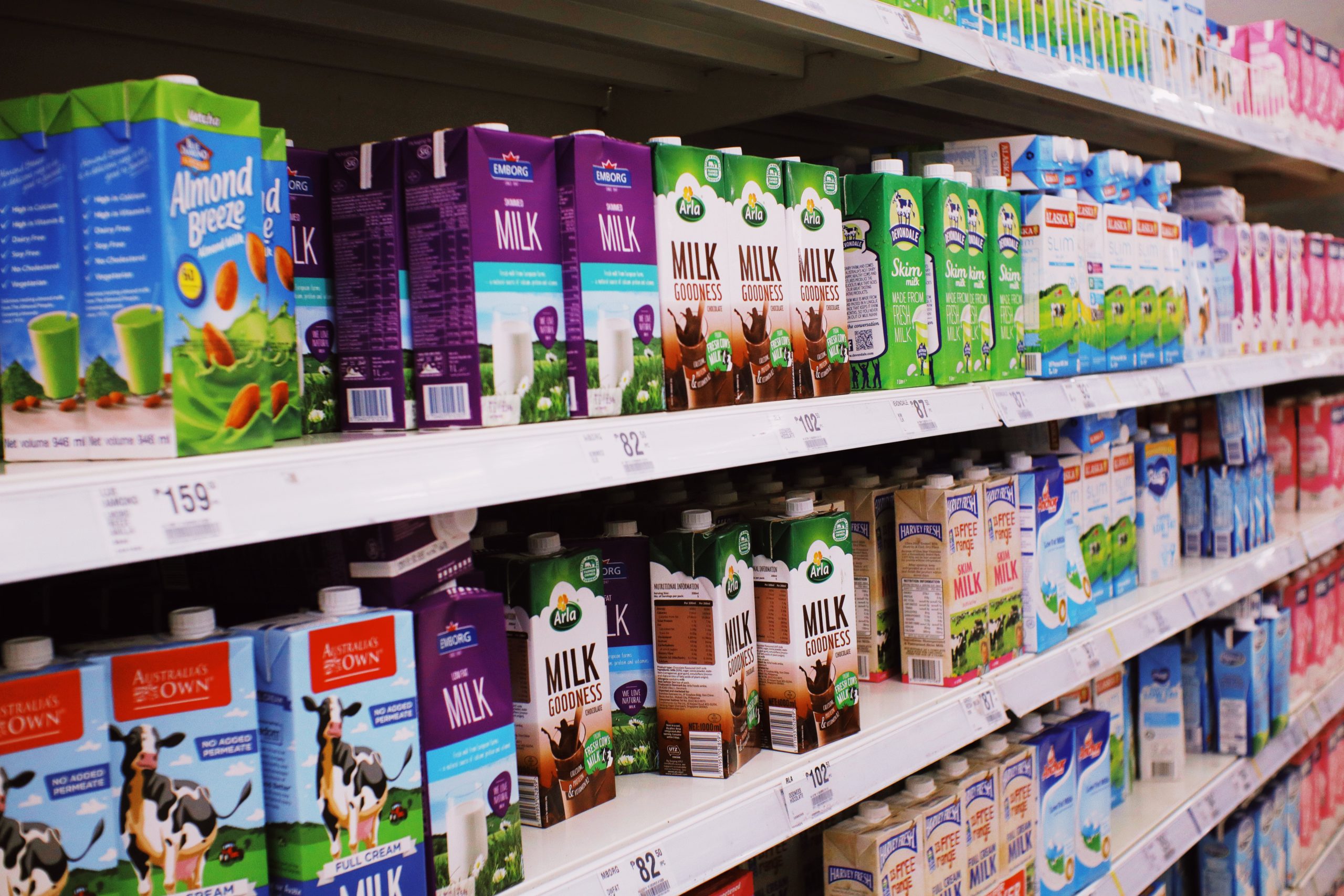 Supermarket shelf with food products. Many food products contain nutrition facts labels.