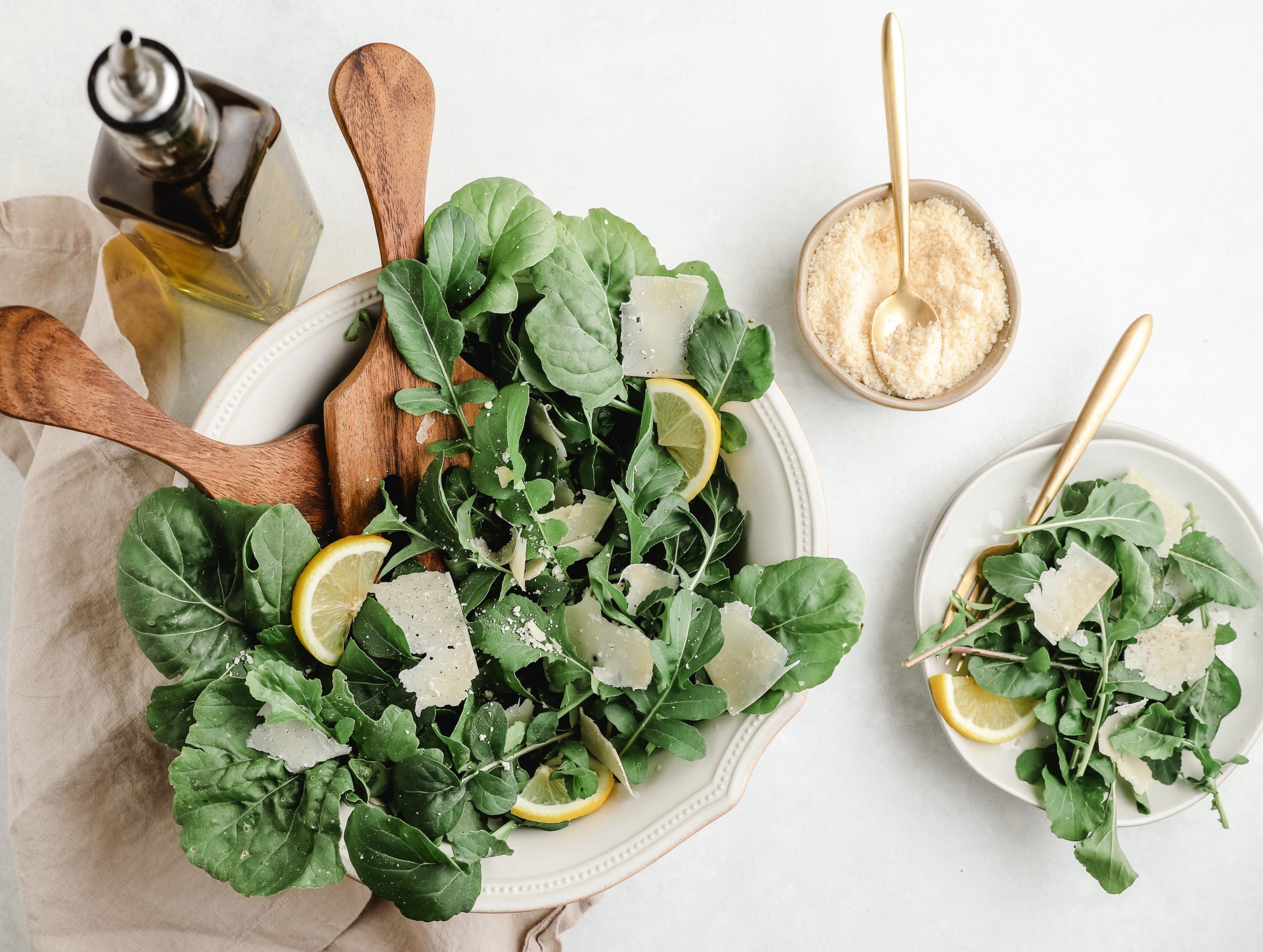 Spinach salad with lemon and cheese garnishes. Spinach is a great source of iron which is one of many essential minerals for health.